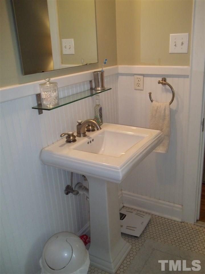 507 Cleveland Street Raleigh, NC 27605 - Photo 21 of 25 a bathroom with a sink and mirror