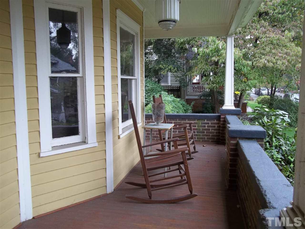 507 Cleveland Street Raleigh, NC 27605 - Photo 4 of 25 a view of a porch with chairs and potted plants