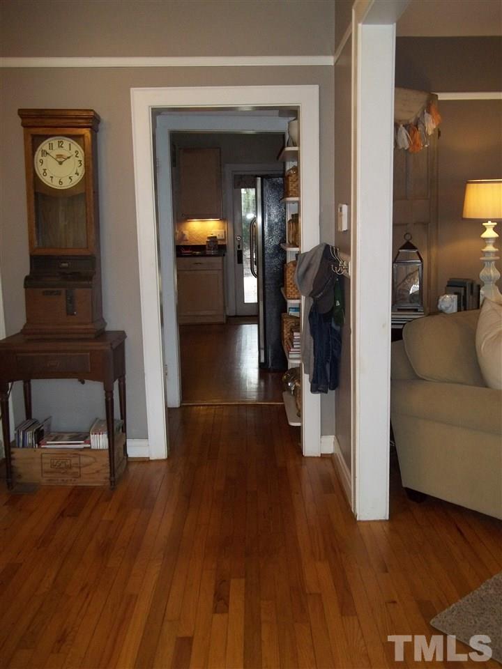 507 Cleveland Street Raleigh, NC 27605 - Photo 5 of 25 a view of a hallway with wooden floor and furniture
