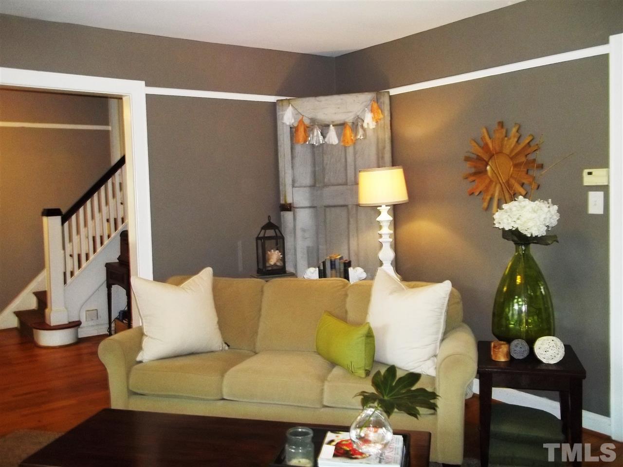 507 Cleveland Street Raleigh, NC 27605 - Photo 8 of 25 a living room with furniture and a lamp