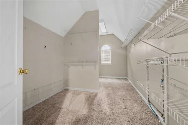 a view of a hallway with a white walls