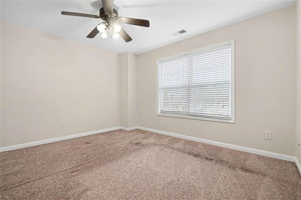 3183 Gus Robinson Road Powder Springs, GA 30127 - Photo 21 of 27 a view of an empty room with a window