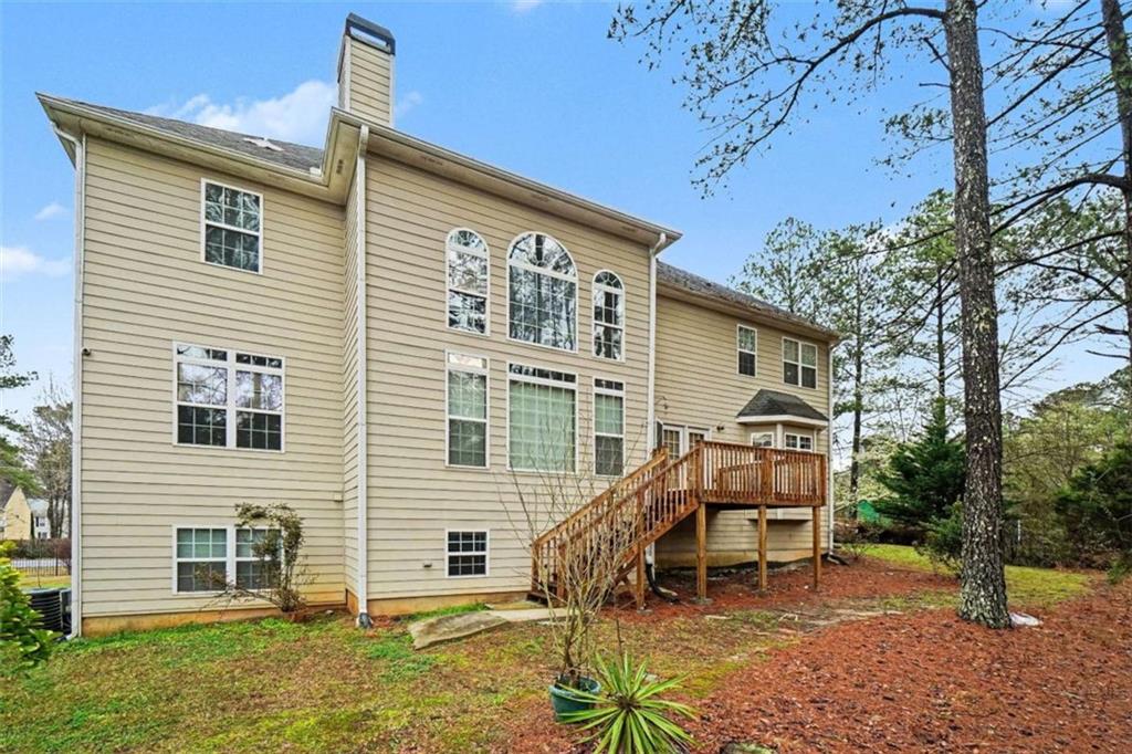 3183 Gus Robinson Road Powder Springs, GA 30127 - Photo 25 of 27 a blue bench sitting in front of a house