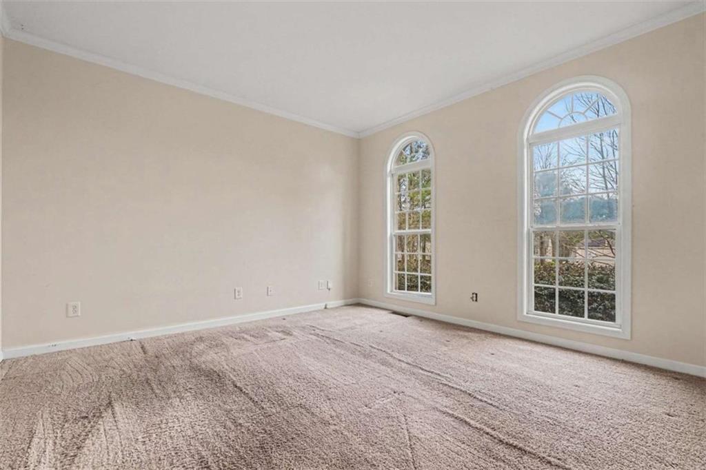 3183 Gus Robinson Road Powder Springs, GA 30127 - Photo 5 of 27 an empty room with windows