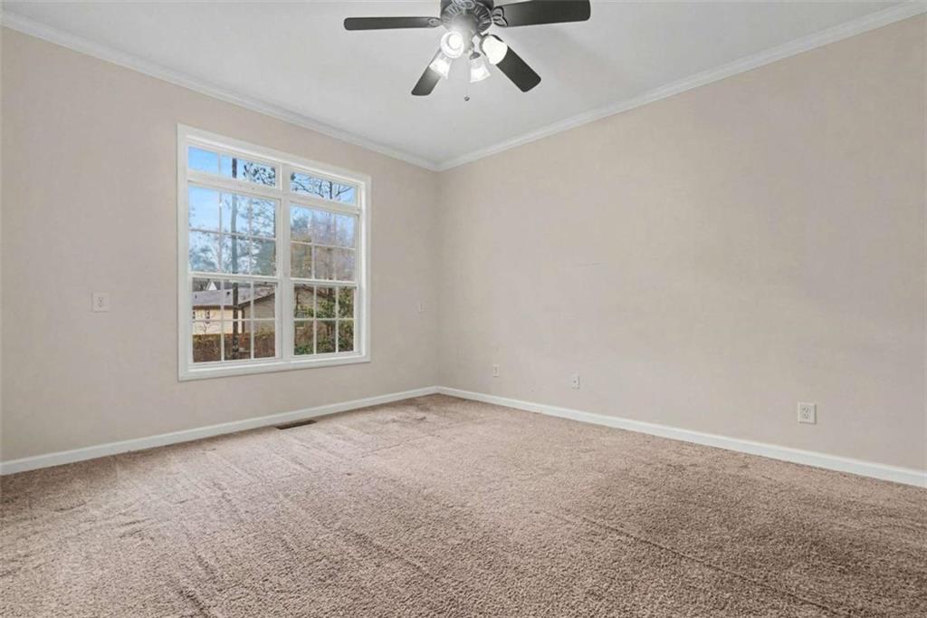 3183 Gus Robinson Road Powder Springs, GA 30127 - Photo 10 of 27 a view of an empty room with a window