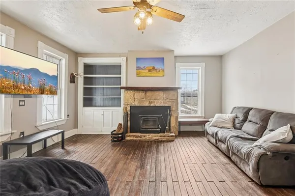a living room with furniture and a fireplace