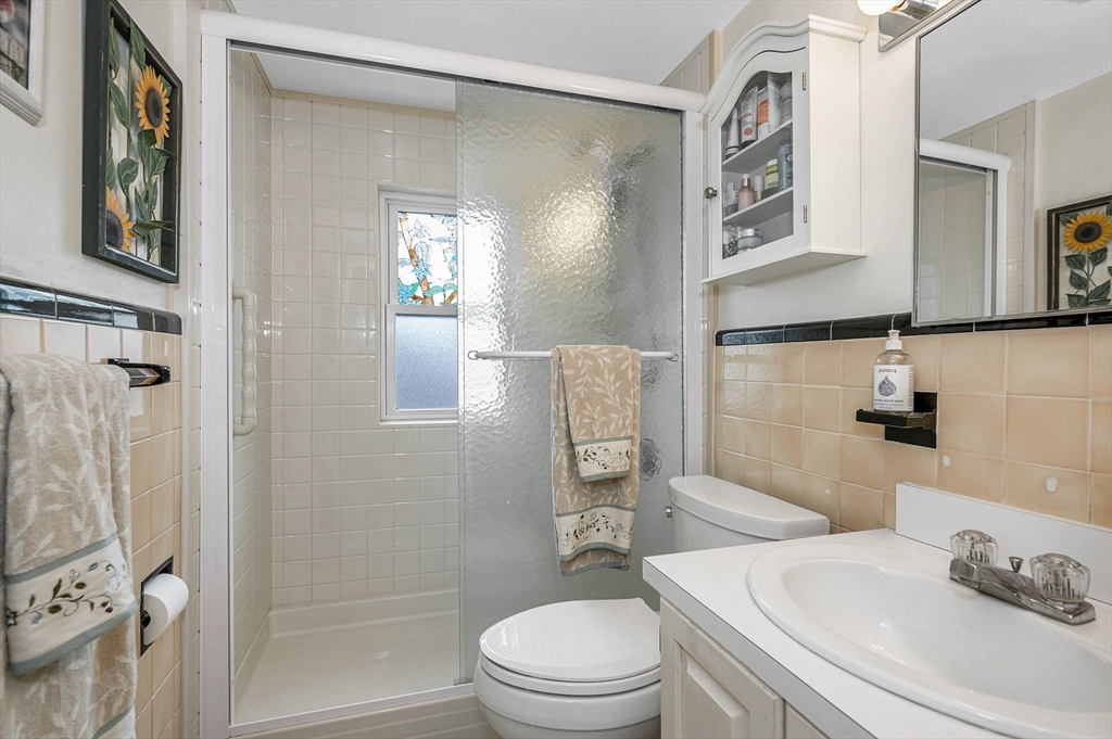 9 Allen Road Waltham, MA 02453 - Photo 15 of 40 a bathroom with a sink toilet and shower