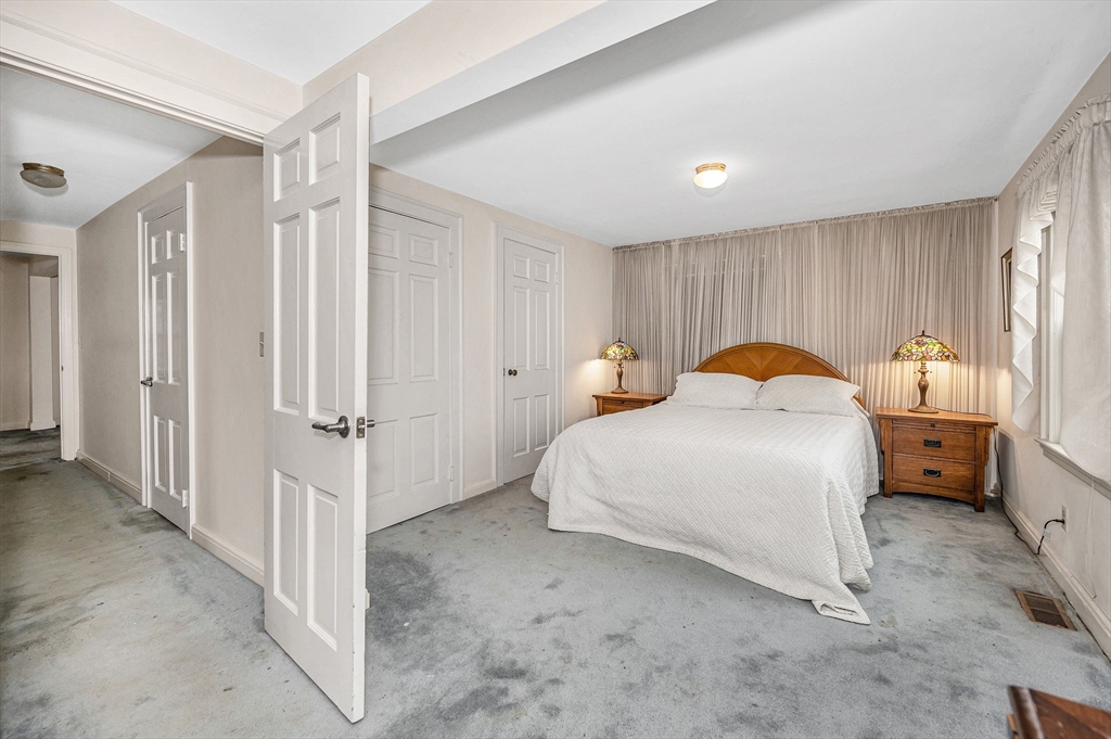 9 Allen Road Waltham, MA 02453 - Photo 16 of 40 a bedroom with a bed and a window