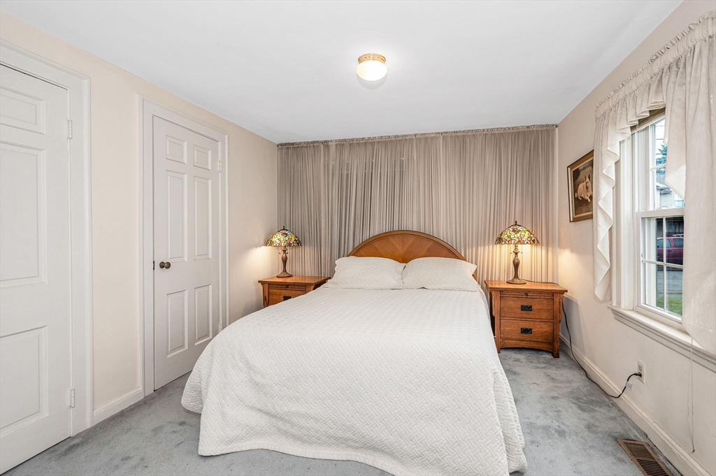 9 Allen Road Waltham, MA 02453 - Photo 17 of 40 a bedroom with a bed and a window