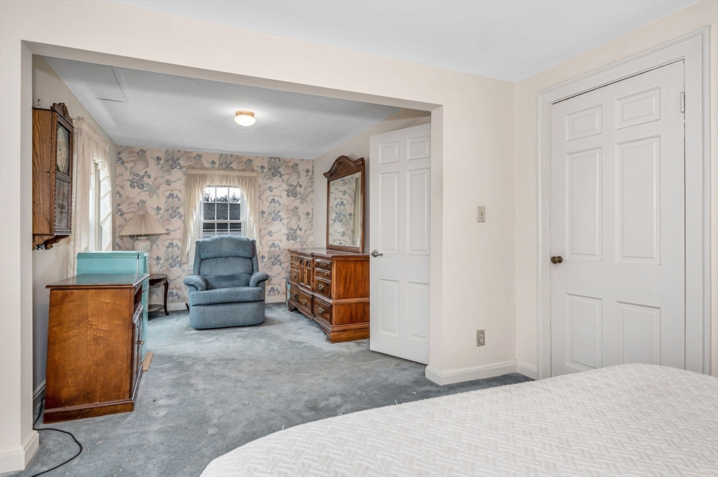 9 Allen Road Waltham, MA 02453 - Photo 18 of 40 a living room with furniture and a wooden floor