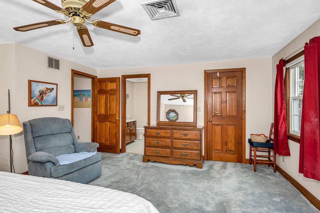 9 Allen Road Waltham, MA 02453 - Photo 21 of 40 a living room with furniture a ceiling fan and a rug