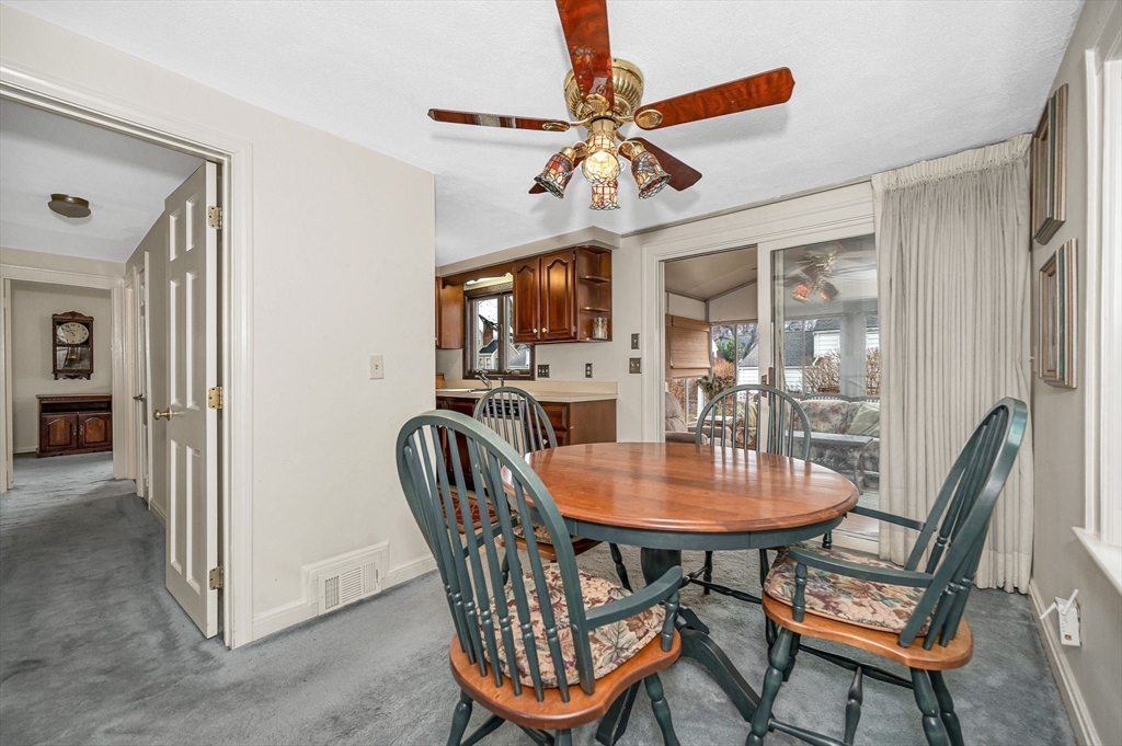 9 Allen Road Waltham, MA 02453 - Photo 9 of 40 a dining room with furniture a chandelier and window
