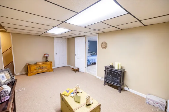 a room with furniture and a flat screen tv