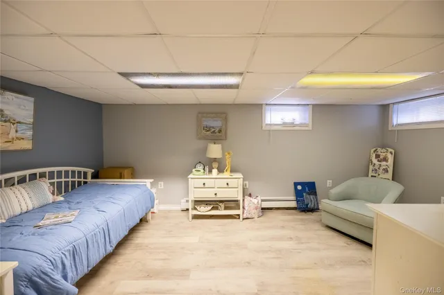 a spacious bedroom with a bed and a couch