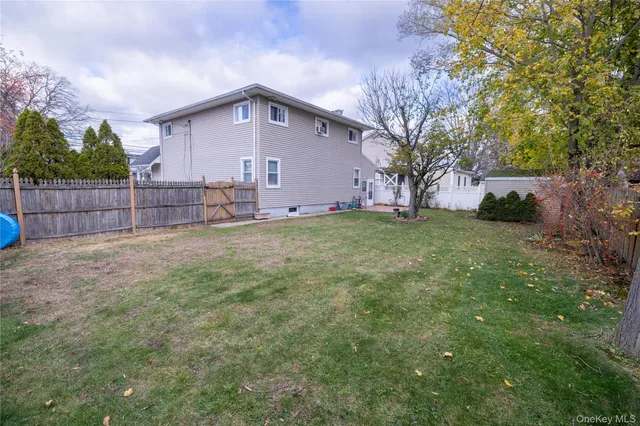 a big house with a big yard and large trees