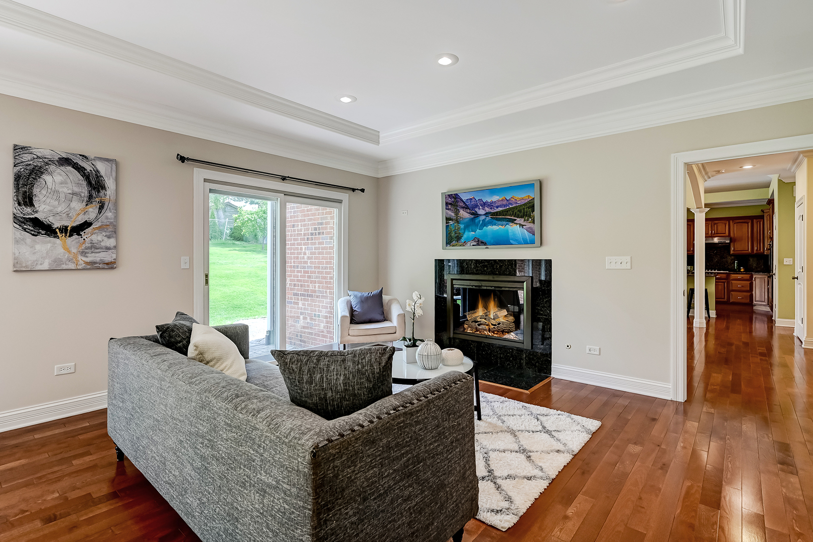 8827 Palisades Road Burr Ridge, IL 60527 - Photo 20 of 35 a living room with furniture and a fireplace