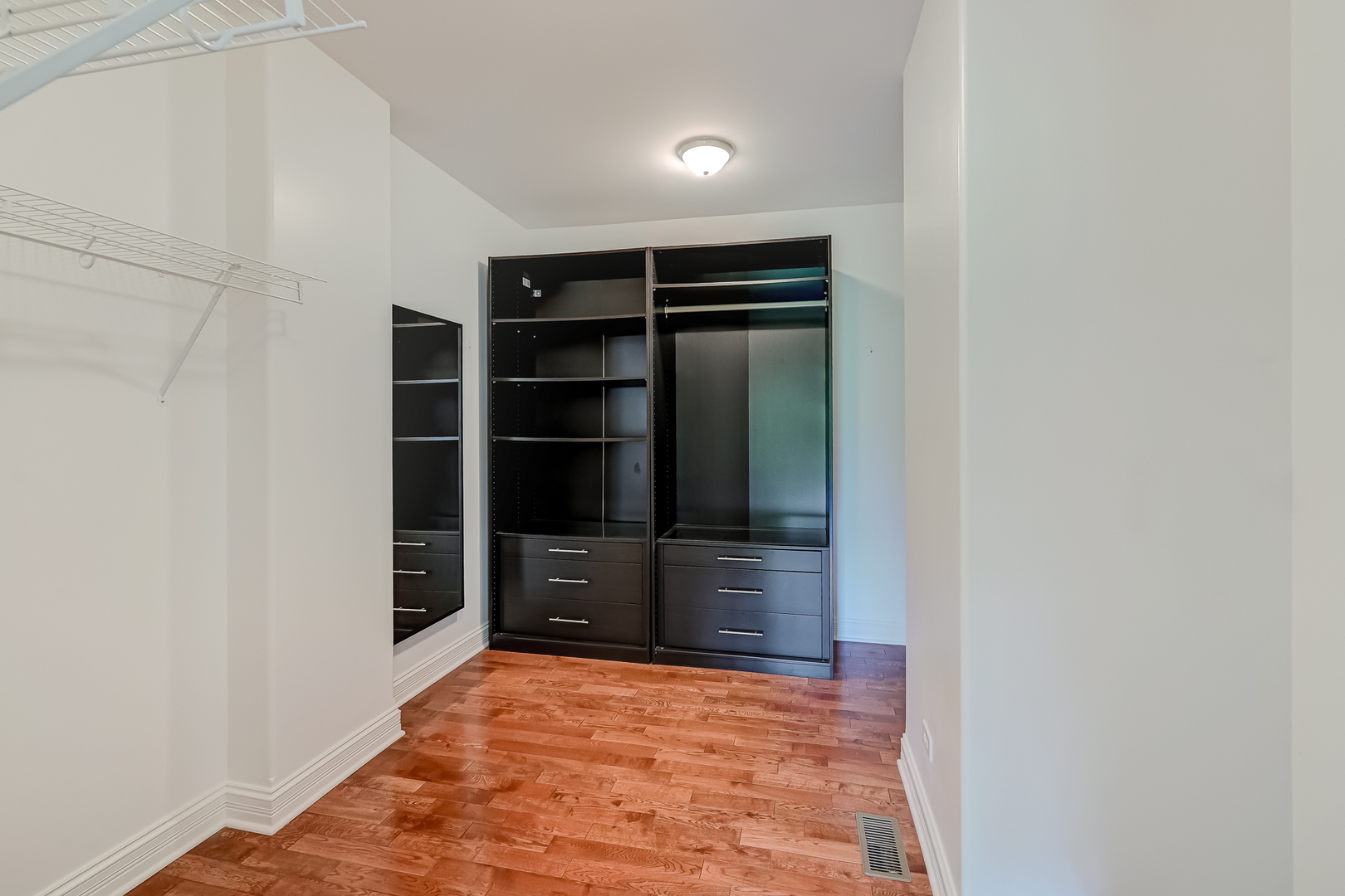 8827 Palisades Road Burr Ridge, IL 60527 - Photo 23 of 35 a view of walk in closet with empty racks