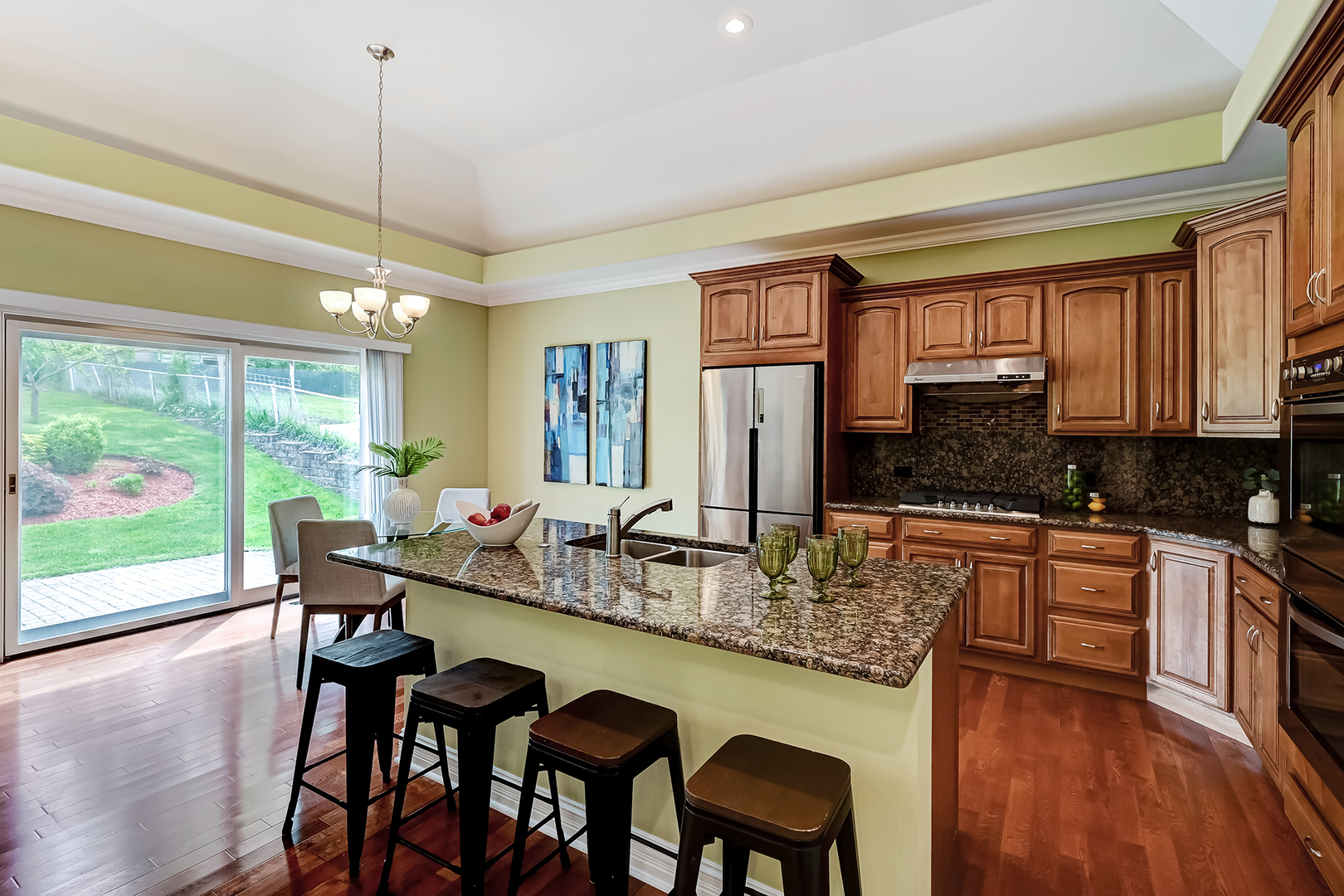 8827 Palisades Road Burr Ridge, IL 60527 - Photo 9 of 35 a dining table chairs next to a window