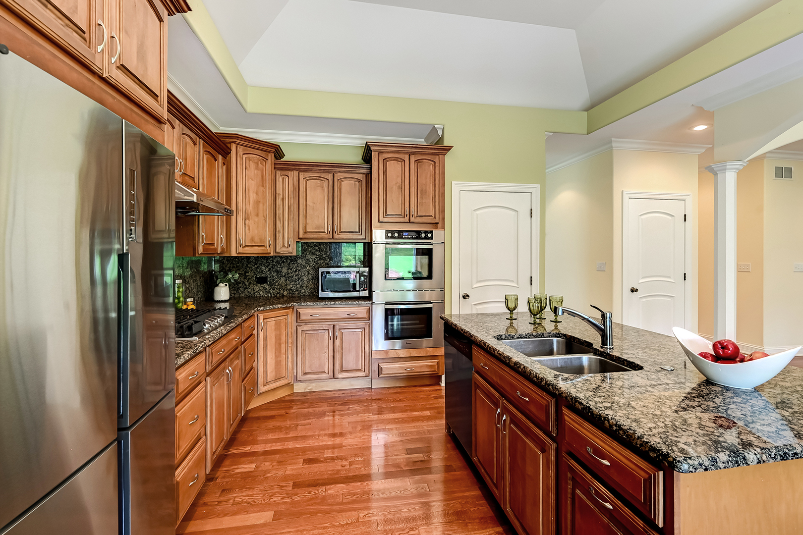 8827 Palisades Road Burr Ridge, IL 60527 - Photo 10 of 35 a kitchen with stainless steel appliances granite countertop a sink and cabinets