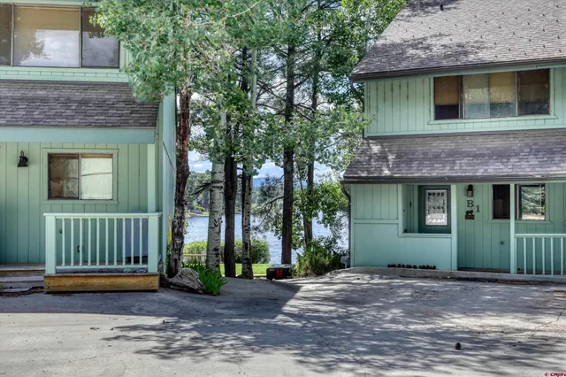 a view of a house with a garden and plants