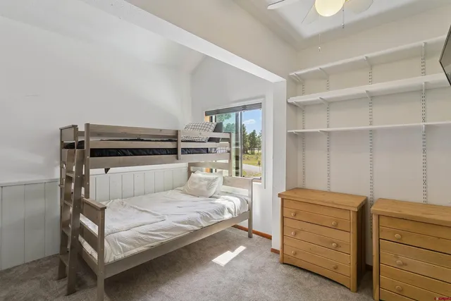 a room with a bed and a cabinets