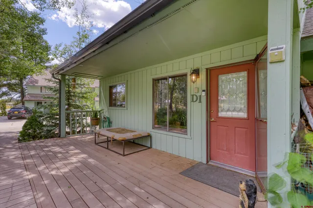 a view of a house with a yard and plants