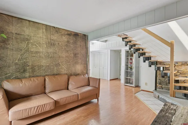 a living room with furniture and a rug