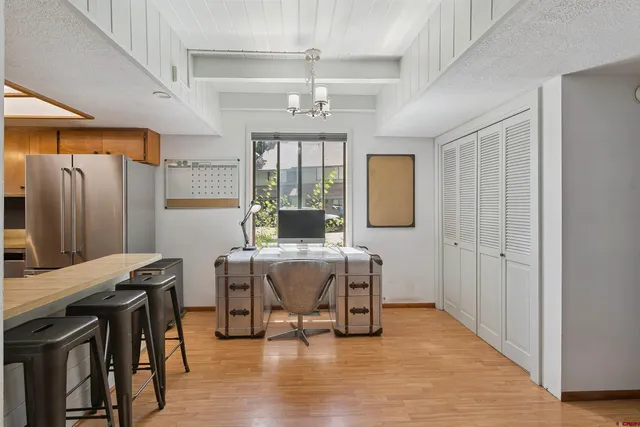 a view of a livingroom with furniture window and wooden floor