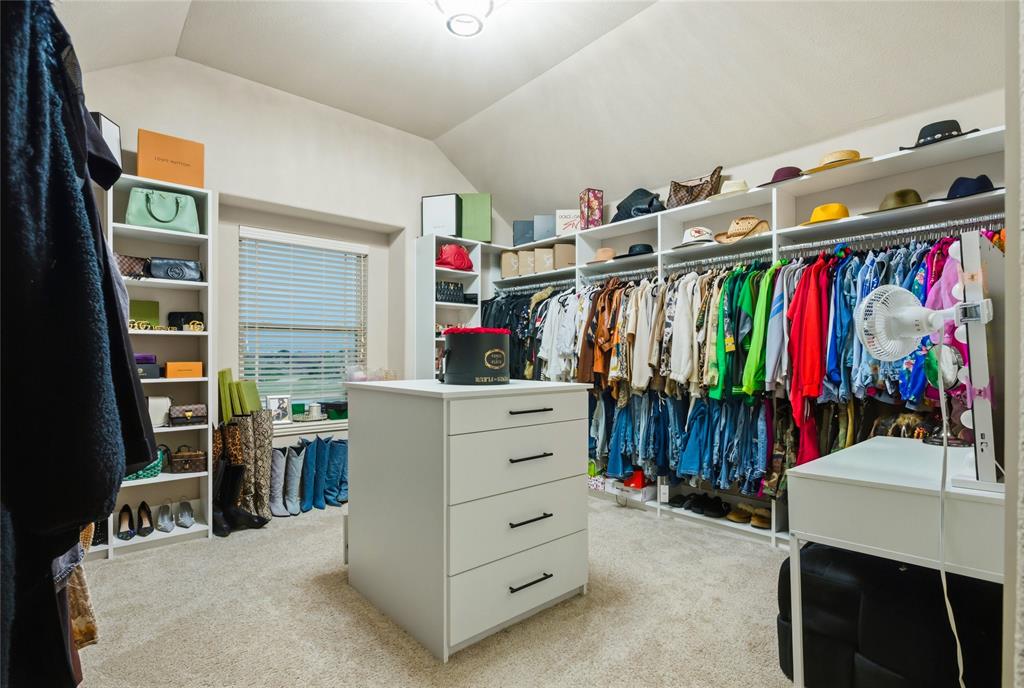 1802 Roundtree Road Forney, TX 75126 - Photo 32 of 39 a view of walk in closet with clothes and shoes