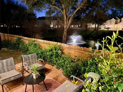 a view of a yard with swimming pool