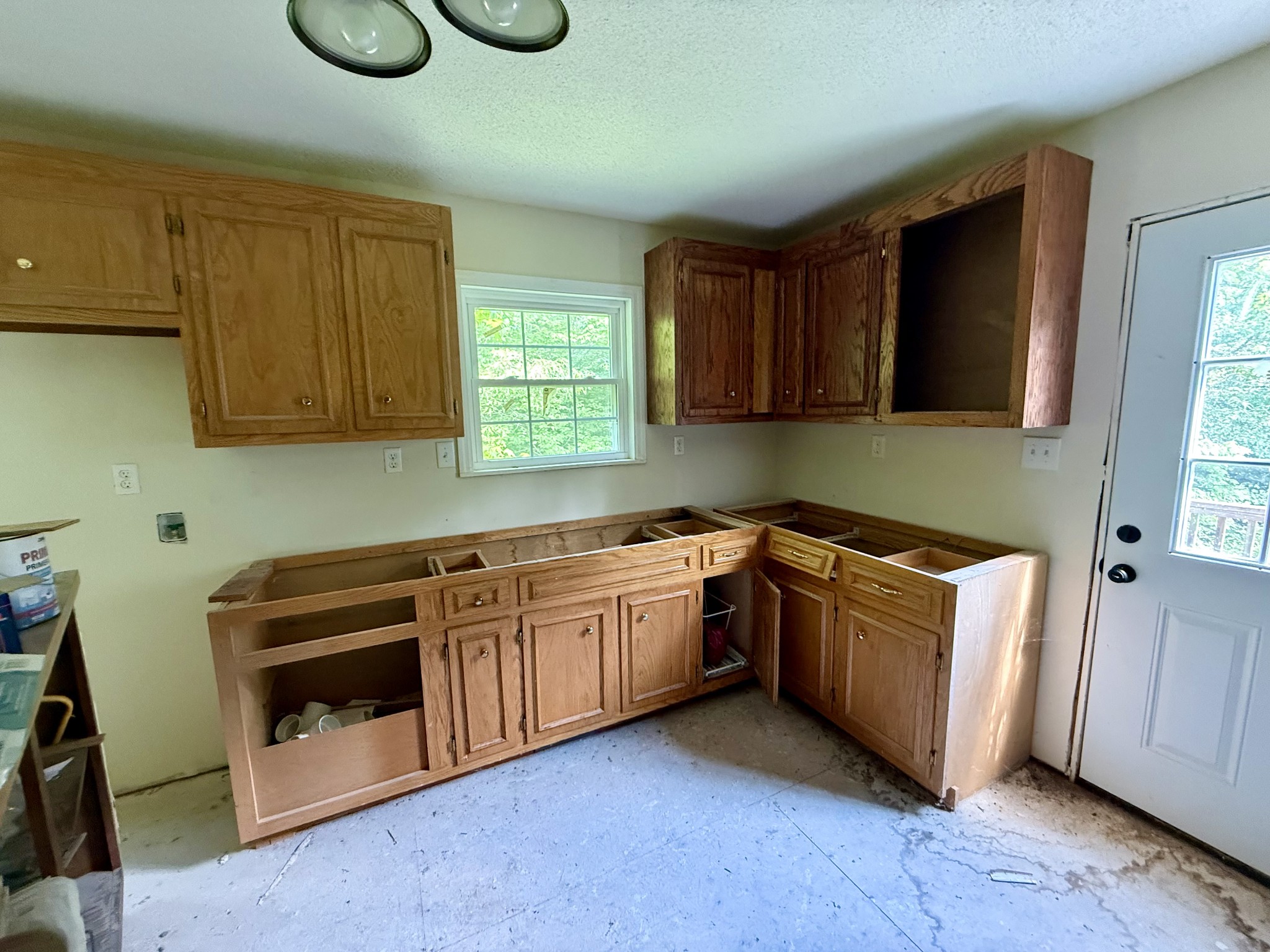 228 Henryville Road Ethridge, TN 38456 - Photo 52 of 55 a kitchen with granite countertop a sink a stove and cabinets