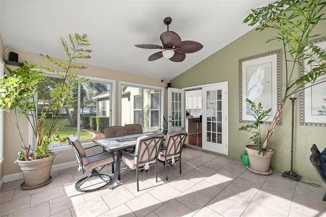 a living room with furniture tv and a window
