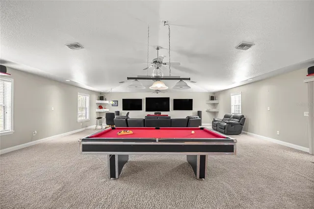 a living room with furniture gym equipment and a window