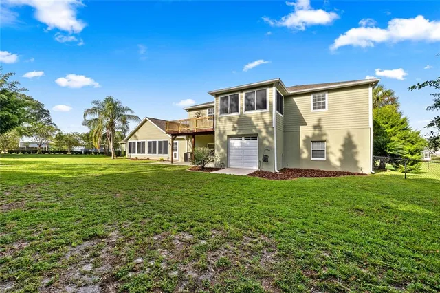 a view of a house with a big yard