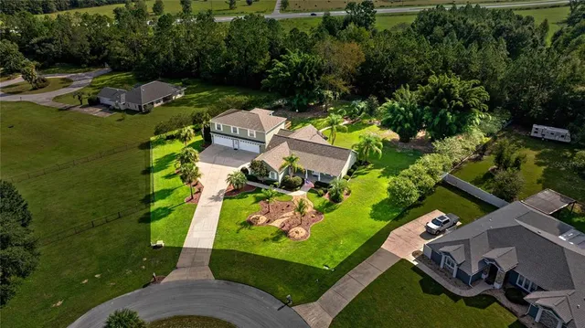 an aerial view of a house with a garden