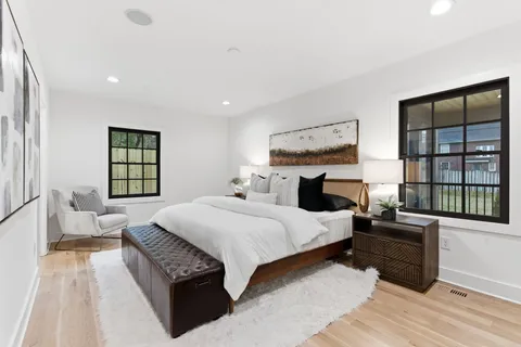 a bedroom with a bed and dresser