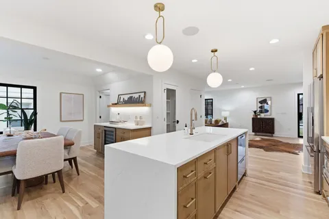a view of a dining room with furniture and window