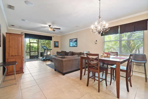 a view of a dining room with furniture window and outside view