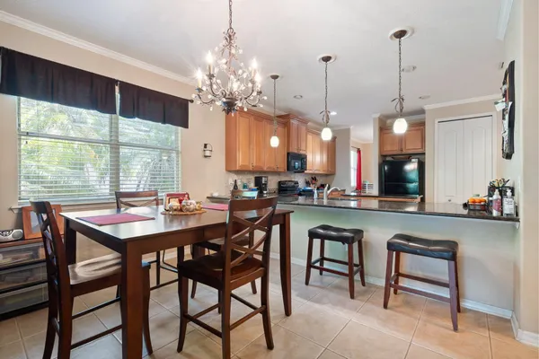 a view of a dining room with furniture window and outside view