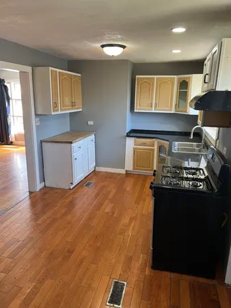 a kitchen with a stove and a refrigerator