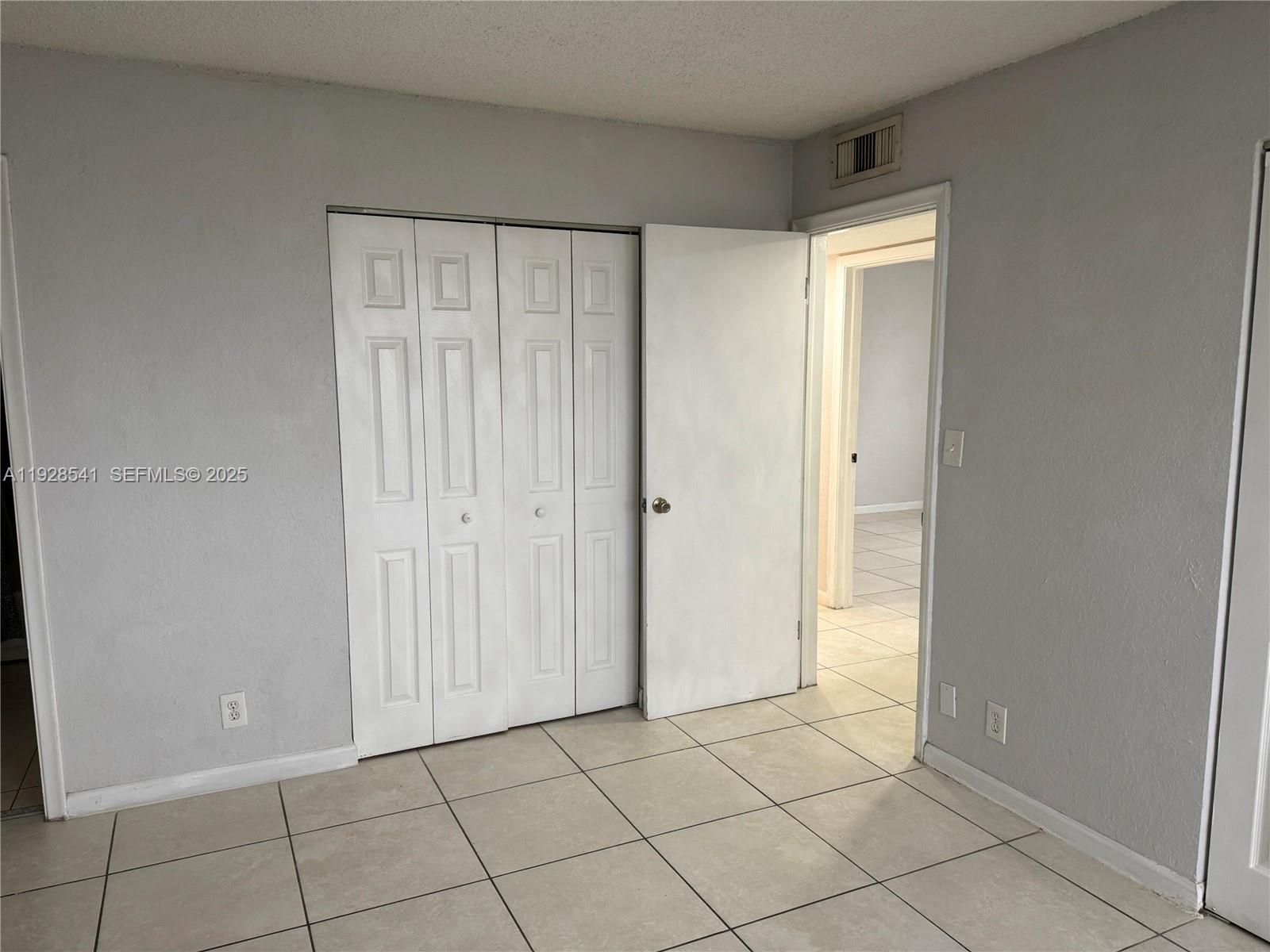 9001 Southwest 77th Avenue, Unit C709 Miami, FL 33156 - Photo 9 of 17 a view of an empty room