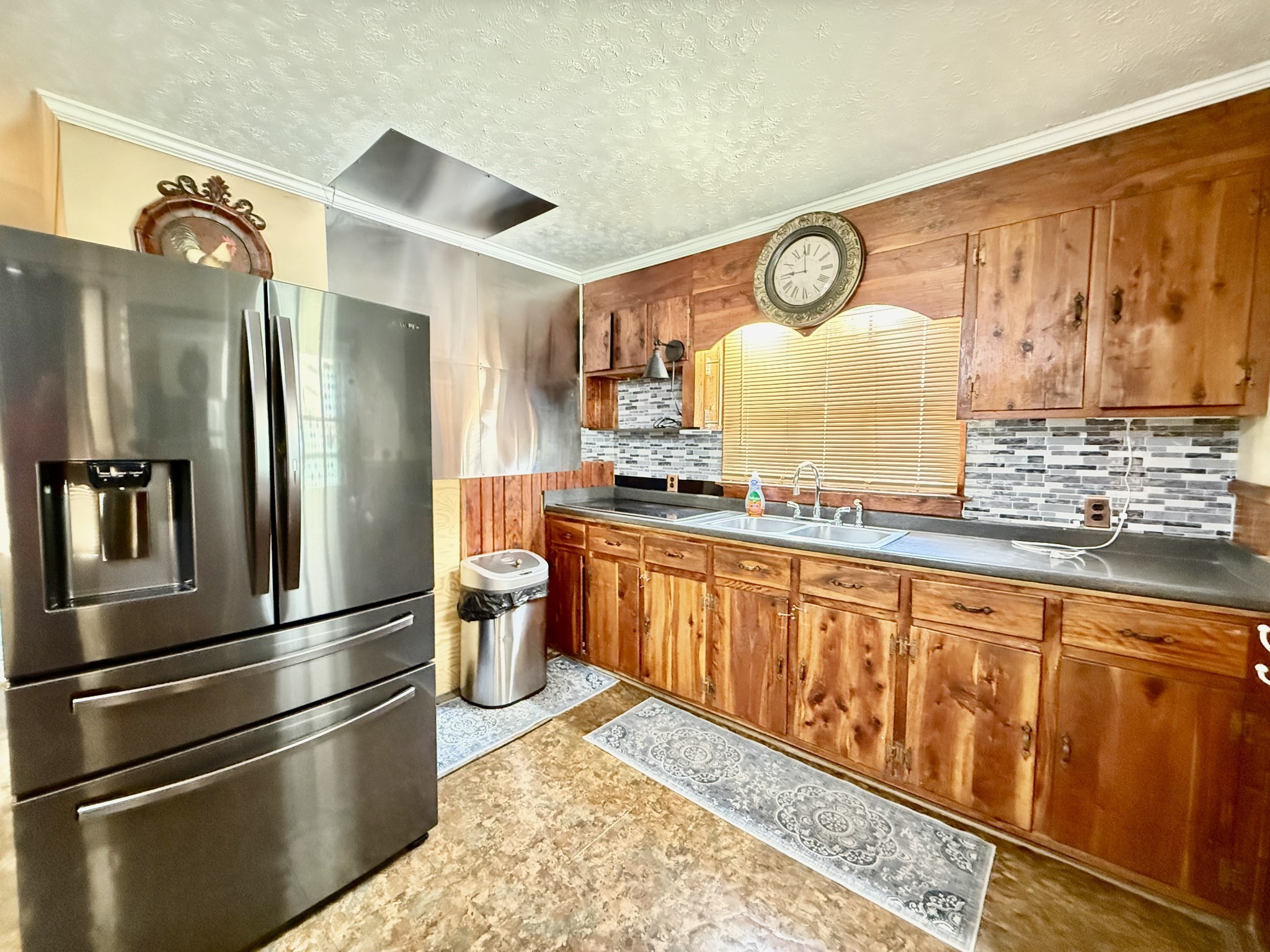 1408 Holly Grove Road Lewisburg, TN 37091 - Photo 12 of 19 a kitchen with stainless steel appliances granite countertop a refrigerator and a stove top oven
