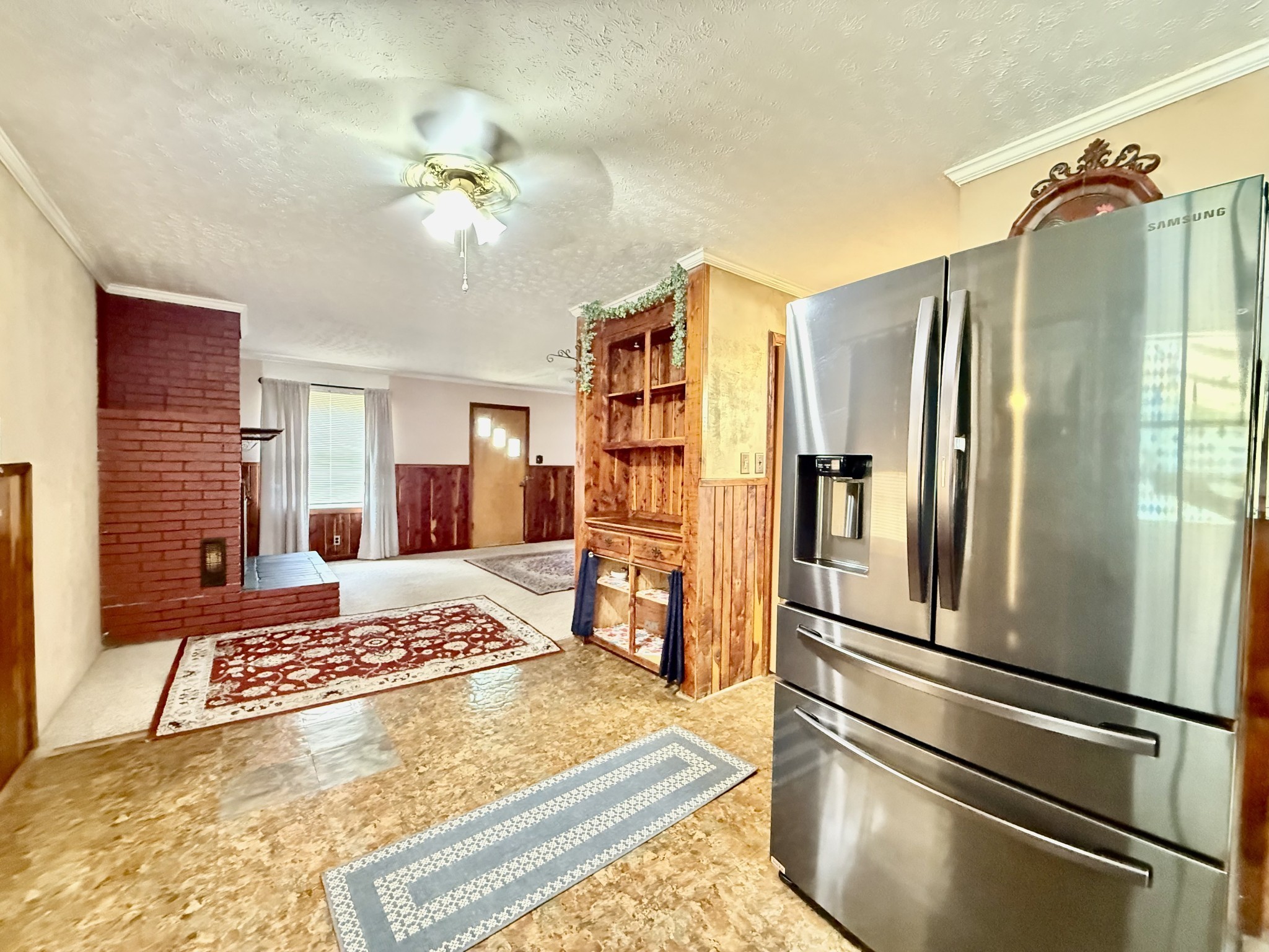 1408 Holly Grove Road Lewisburg, TN 37091 - Photo 13 of 19 a kitchen with stainless steel appliances granite countertop a refrigerator and a stove top oven