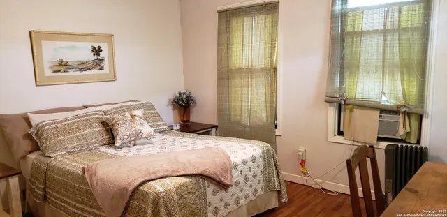 a view of a workspace with furniture and window