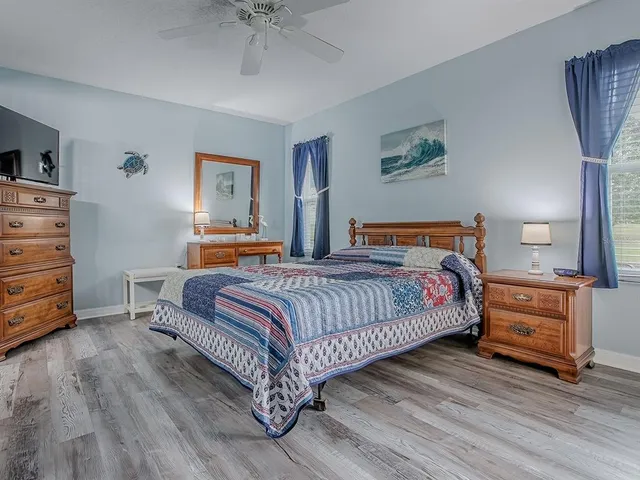 a bedroom with a bed and dresser