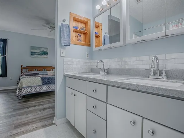 a bathroom with cabinets and a sink