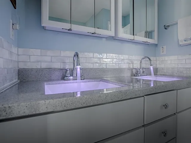 a kitchen with granite countertop a sink and cabinets