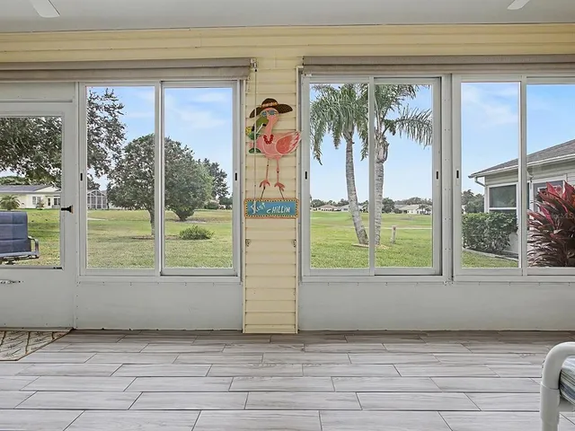 a view of a room that has a bed and a window
