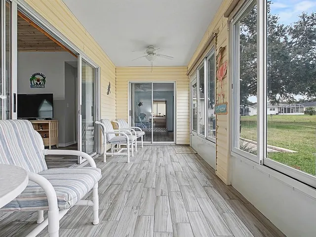 a view of a living room and a wooden floor