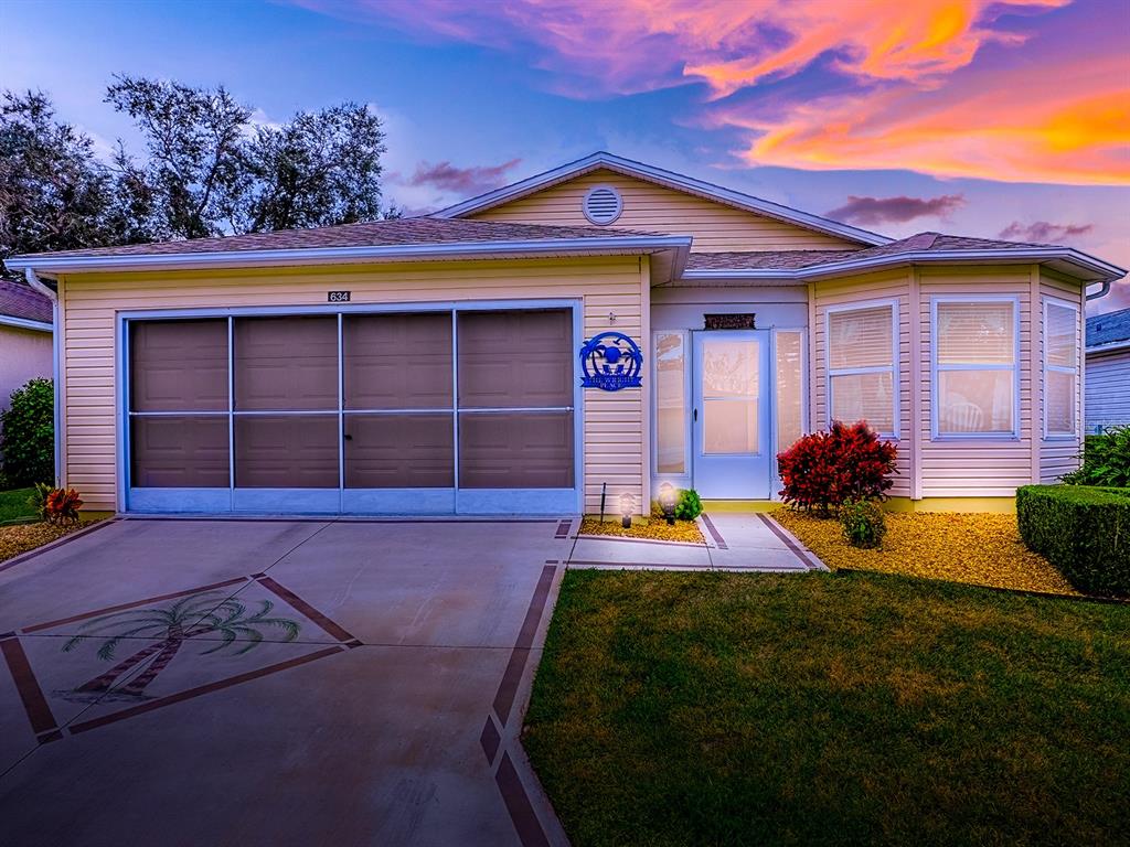 634 Timbercrest Drive Leesburg, FL 34748 - Photo 38 of 38 a front view of a house with a yard